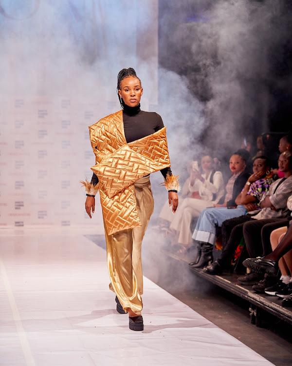Model walks the runway in House of Ayanda designs at Soweto Fashion Week