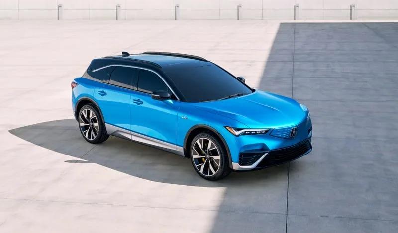 A blue car parked on concrete

Description automatically generated