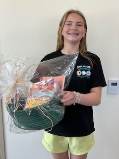 Gwen holding a prize