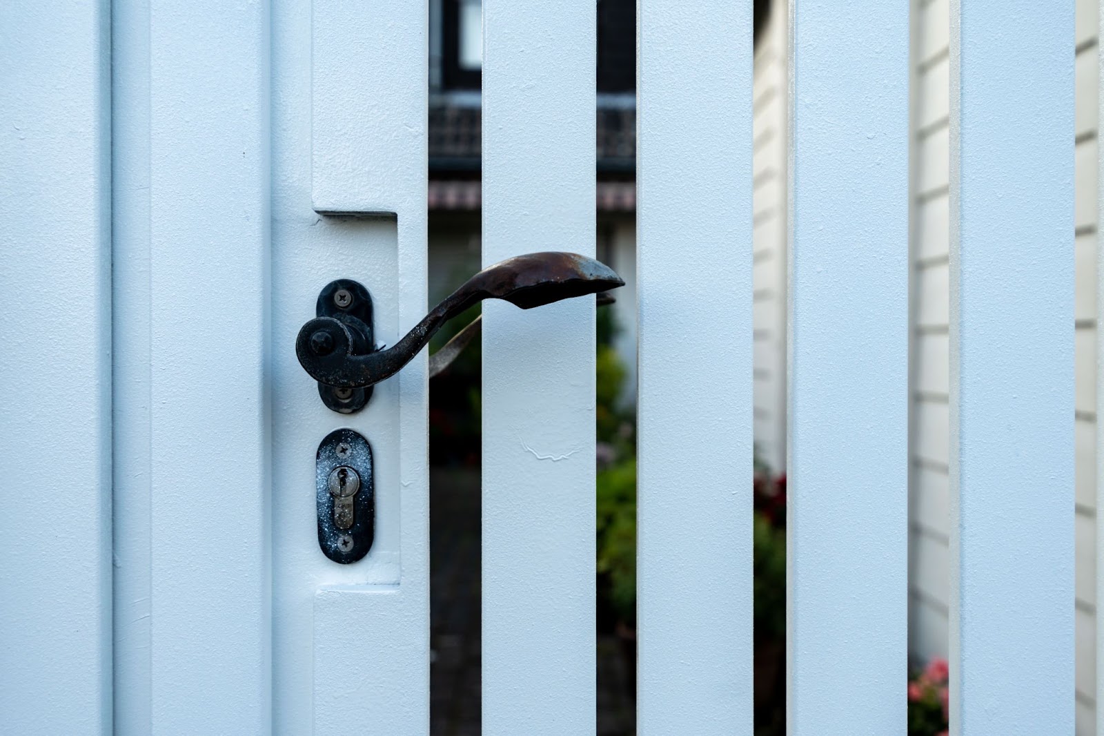 Handle on a gate of a vinyl fence. 