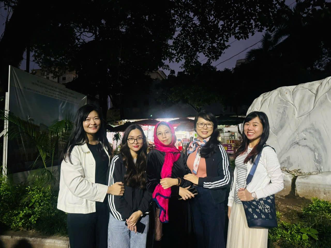 A group of women posing for a photo

Description automatically generated