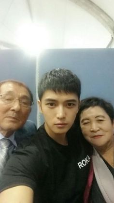 This may contain Kim Jaejoong and his parent taking a selfie