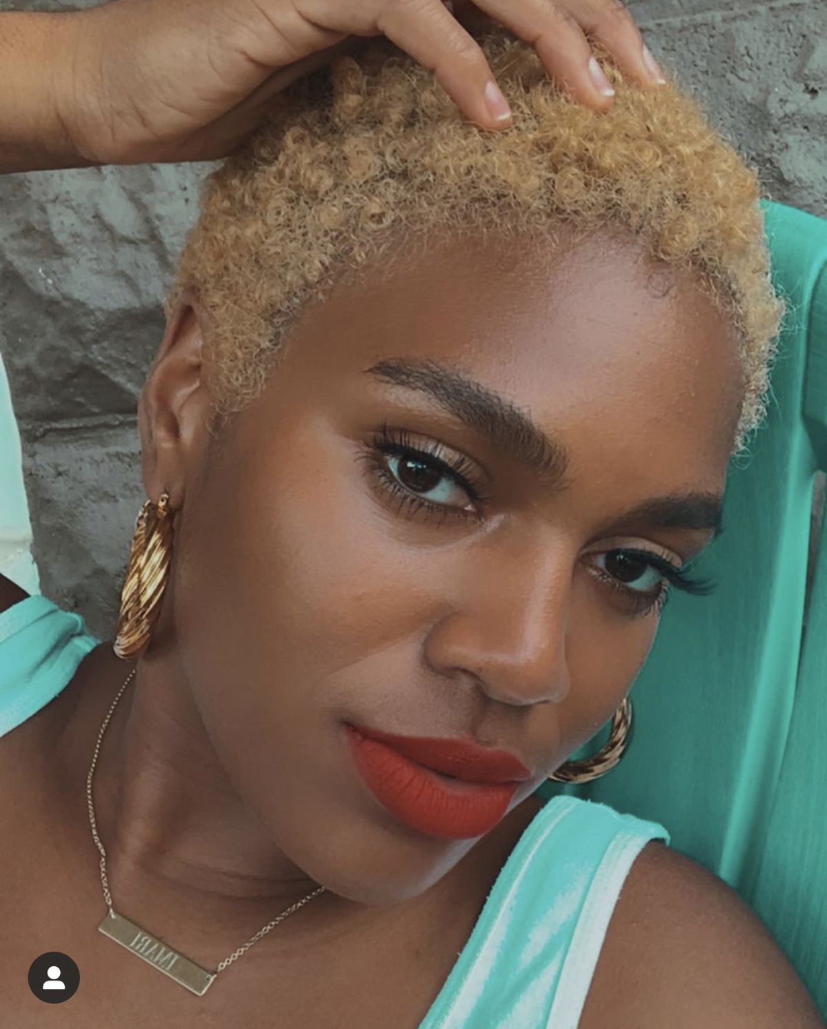 a lady rocking blonde edgy short hair