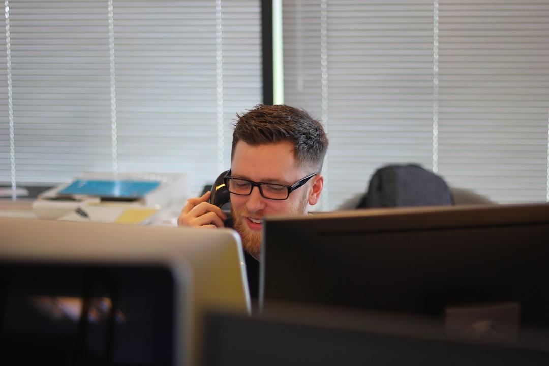 Call center agent using the computer telephony integration system to improve his productivity.