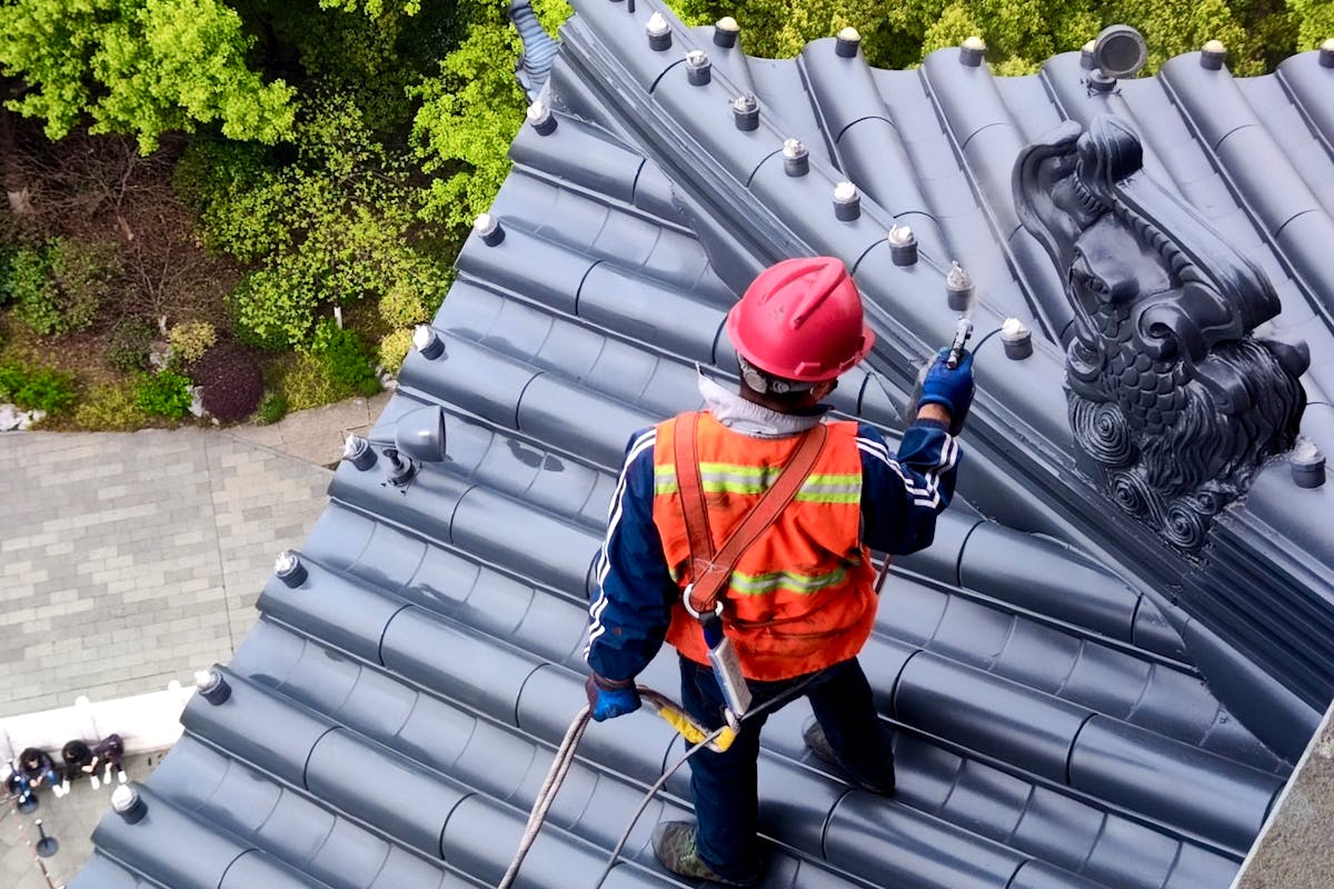 man working on a roof