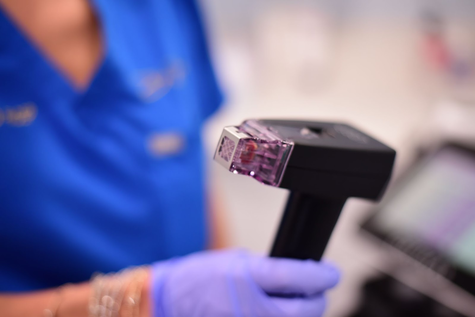 A health care professional holding Morpheus8 device.