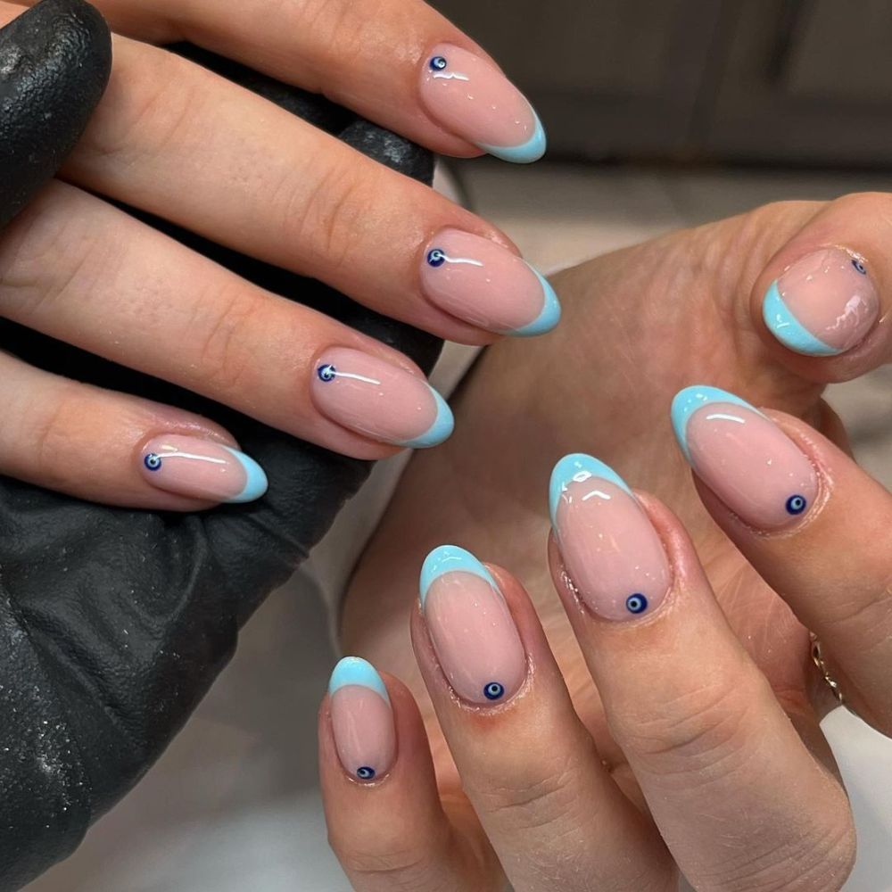 Close up of hands with blue winter nails having Simple winter Nails