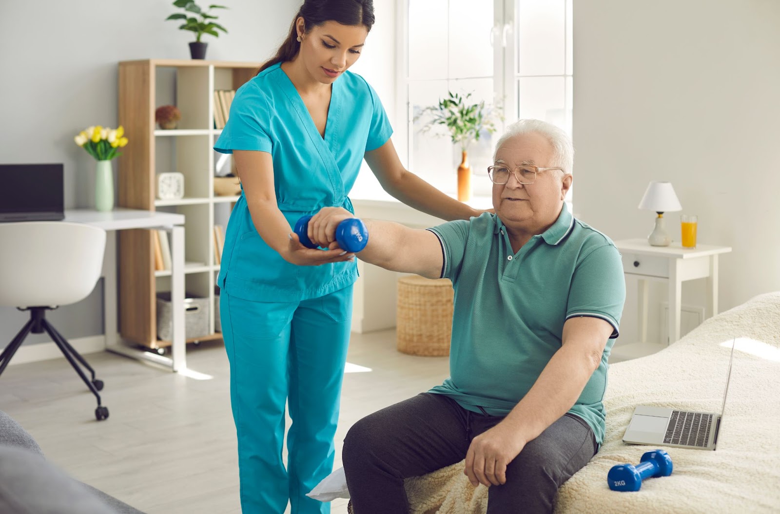 A physical therapist helping an older adult exercise with a light dumbbell in his right hand  while in a seated position.