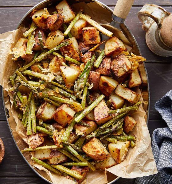 Potatoes and asparagus side dish in serving bowl 