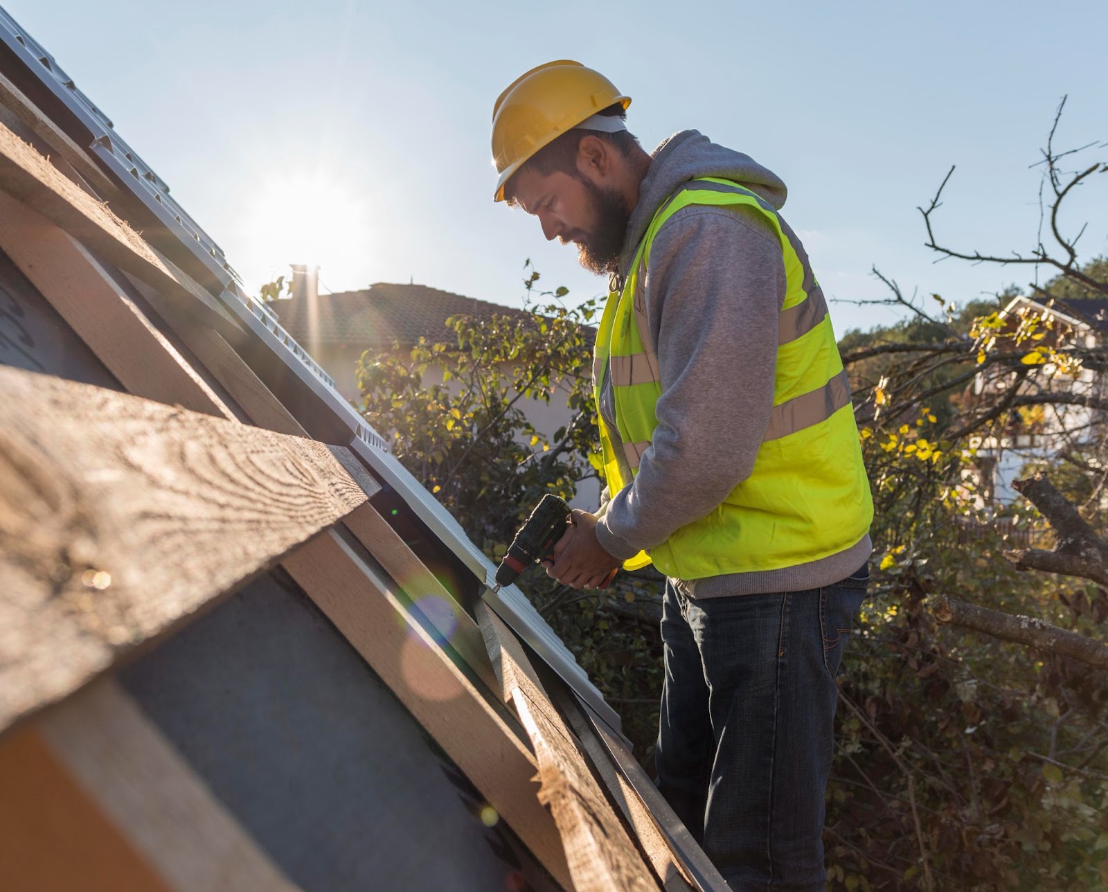 Professional inspector examining roof  for Vancouver senior home winter safety
