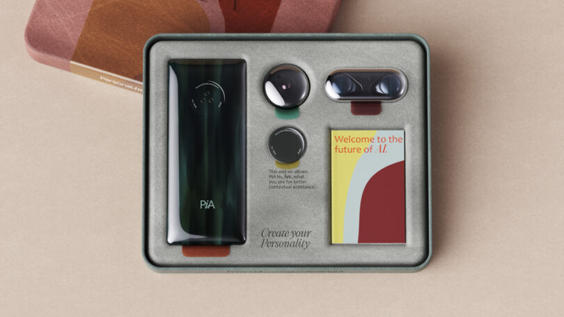 Box containing a digital device, two circular attachments, an oval component, and a booklet titled "Welcome to the future of A.I." with the text "Create your Personality" visible inside.
