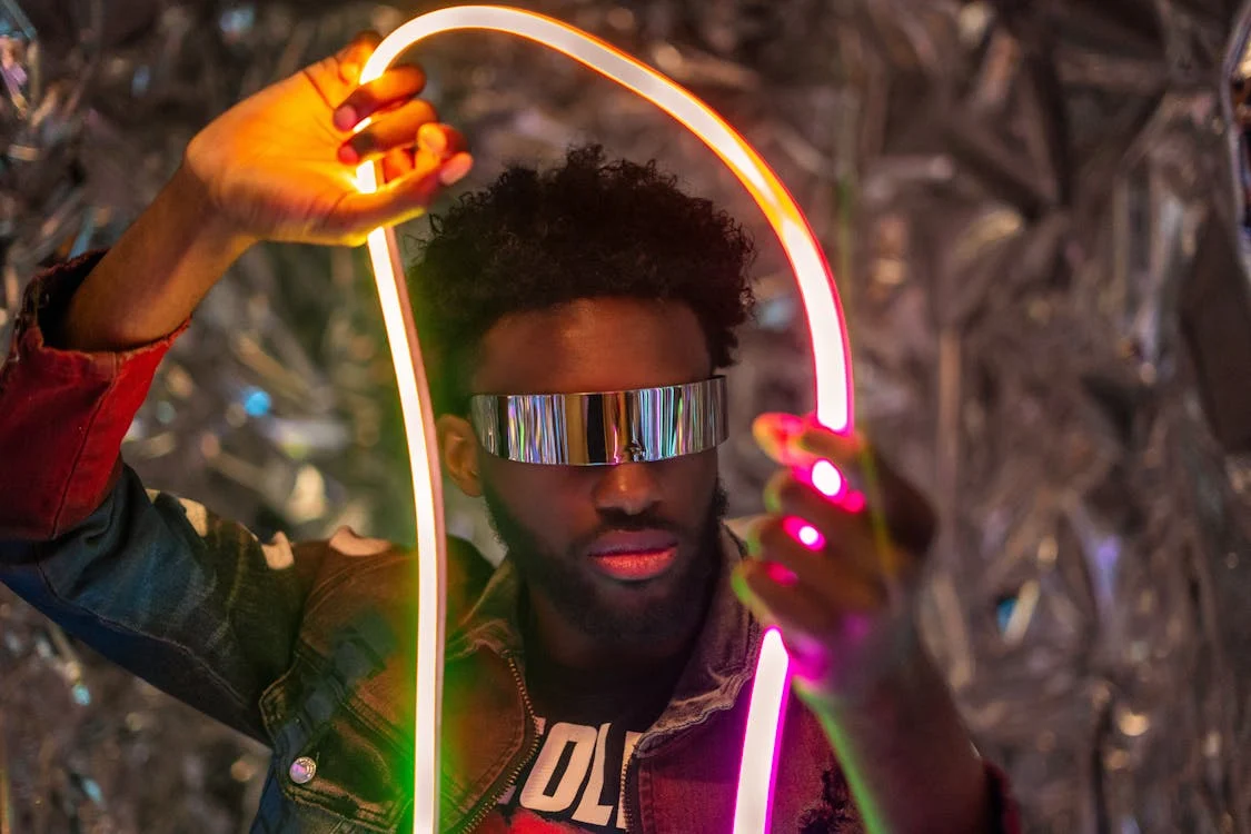 Photo by Fernando Huelgas: https://www.pexels.com/photo/futuristic-portrait-of-man-with-neon-lights-32276095/ 