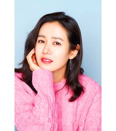 son ye jin on a pink sweater with her hand on her jaw 