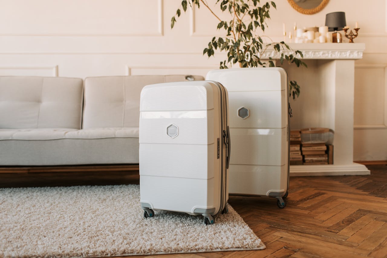 two white suitcases in a room