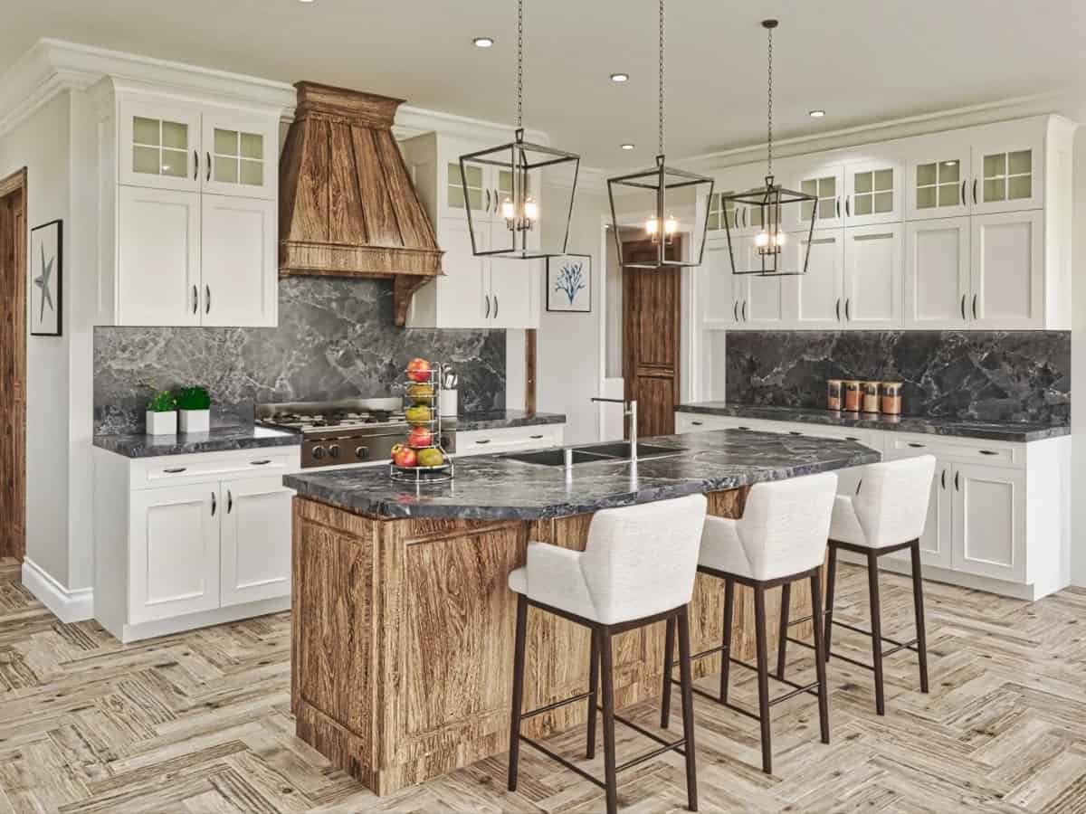 The sleek black and white palette in the kitchen is softened by a wooden island and matching vent hood.