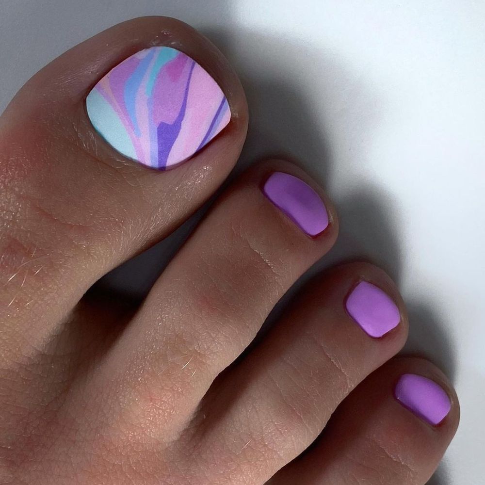 Close up of foot with radiant toe nail having Purple Toe Nail Art