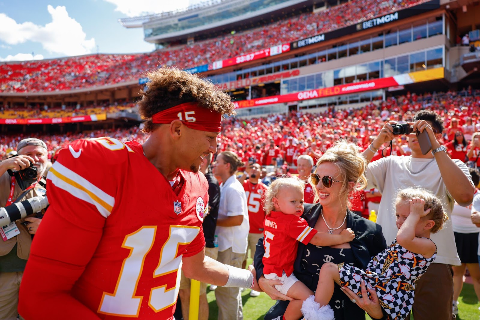 Patrick Mahomes greets his wife, Brittany Mahomes, and their two children Patrick Bronze Lavon Mahomes and Sterling Skye Mahomes prior to the game against the Cincinnati Bengals on September 15, 2024, in Kansas City, Missouri | Source: Getty Images