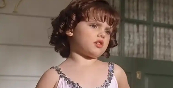 a younger Brittany Ashton Holmes in a movie