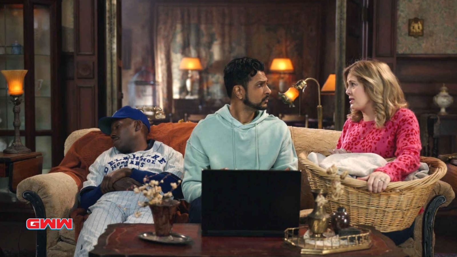 Rose McIver, Lamorne Morris, and Utkarsh Ambudkar sitting in a living room, Ghosts Season 4 Release Date