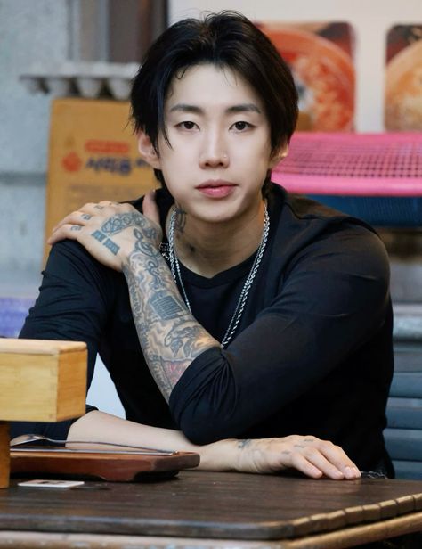 This contain an image of Jay Park, putting on black dress