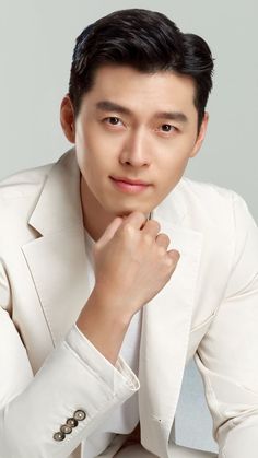 A picture of Hyun Bin' on a white suit 