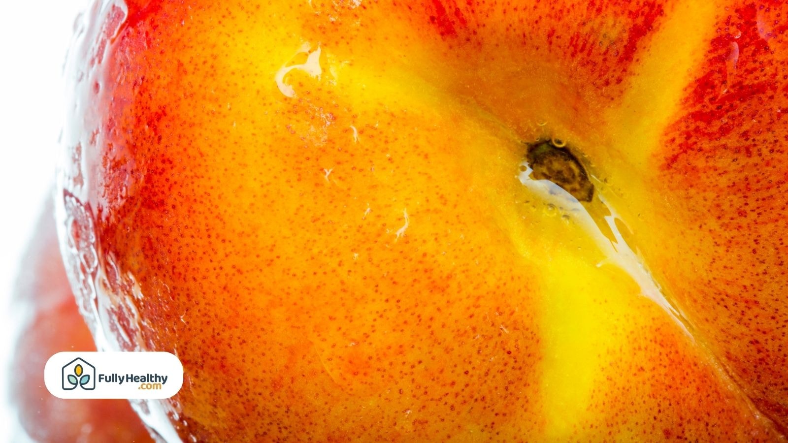 Close-up of juicy peach skin with glistening water drops