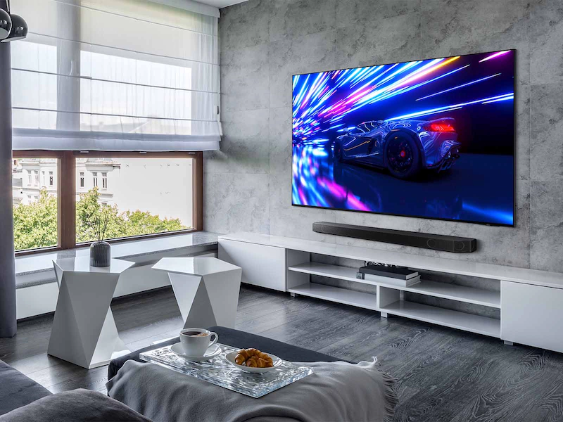 Samsung S95D TV in living room.