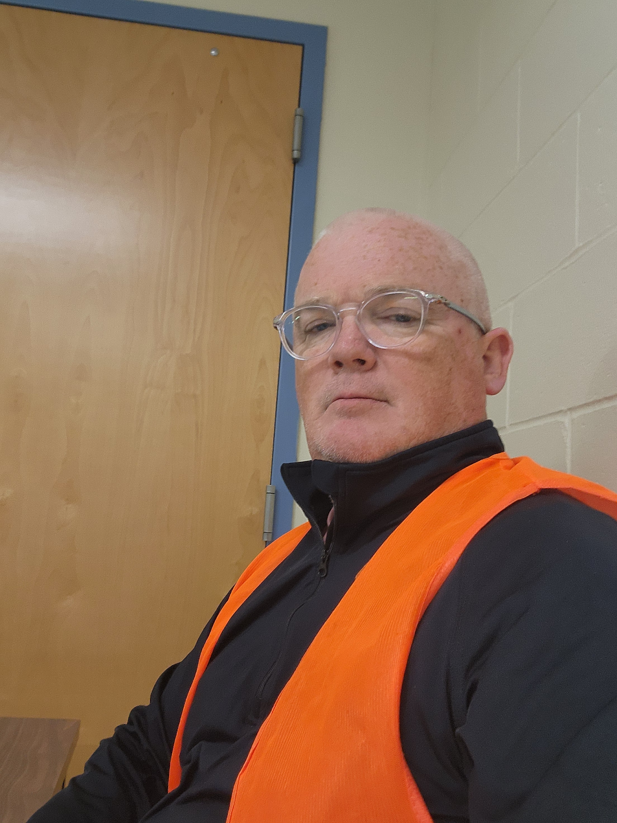 Principal Boyle wearing orange and black