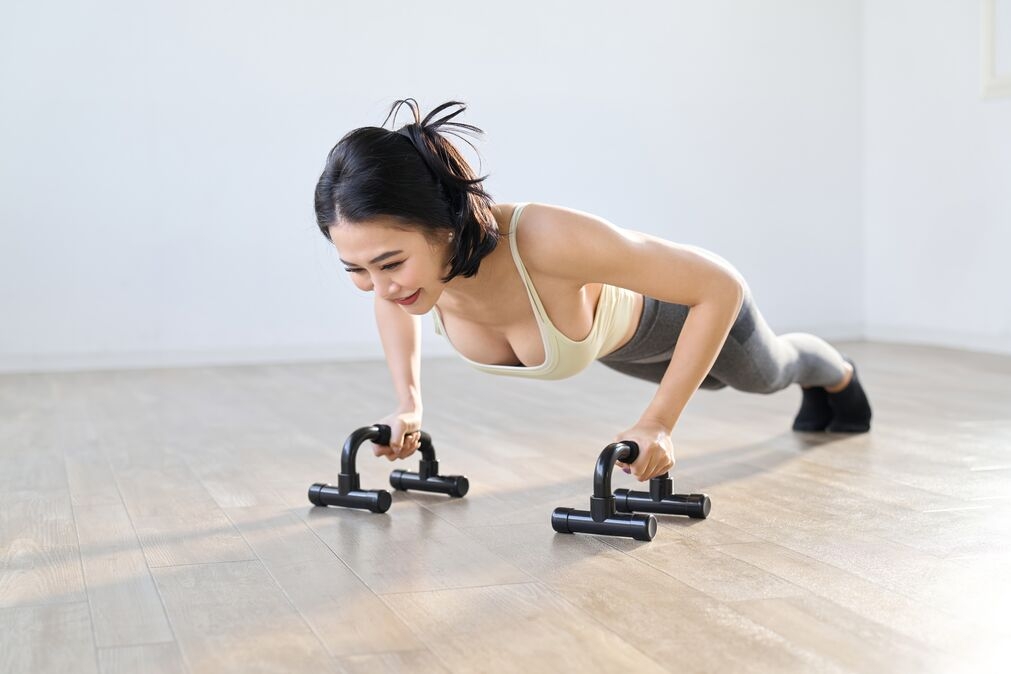 Valgus Extension Overload Exercise - woman doing push ups