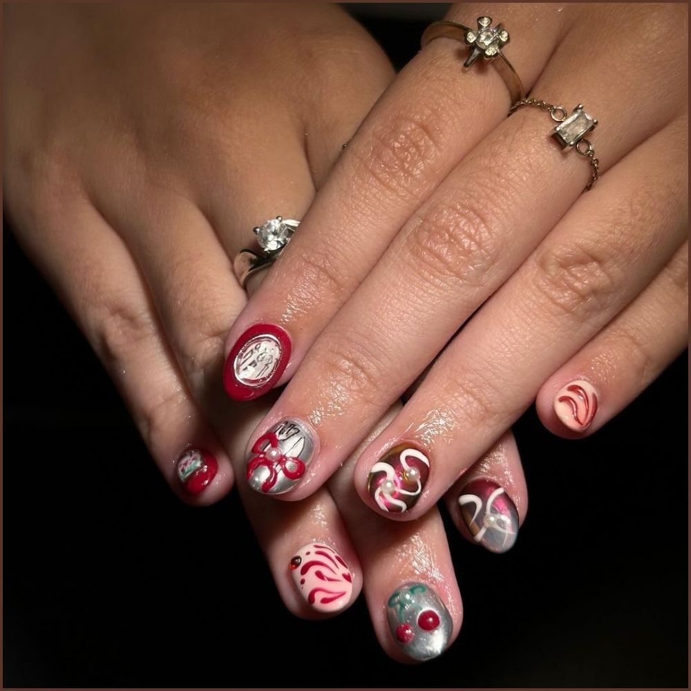 Close up of hands having Christmas red nails with Christmas Ornament-Inspired Nails