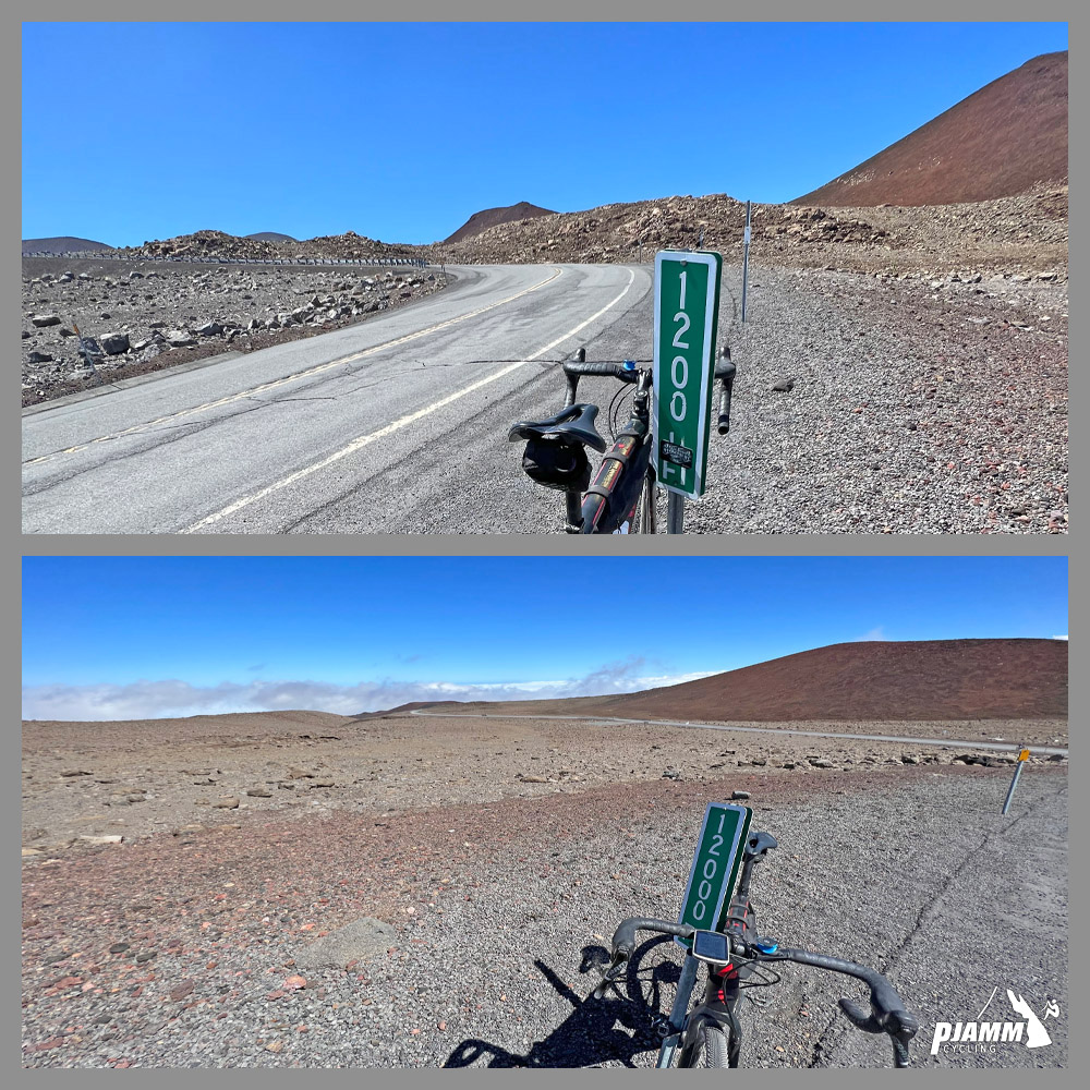 bike parked next to a 12,000 feet elevation sign