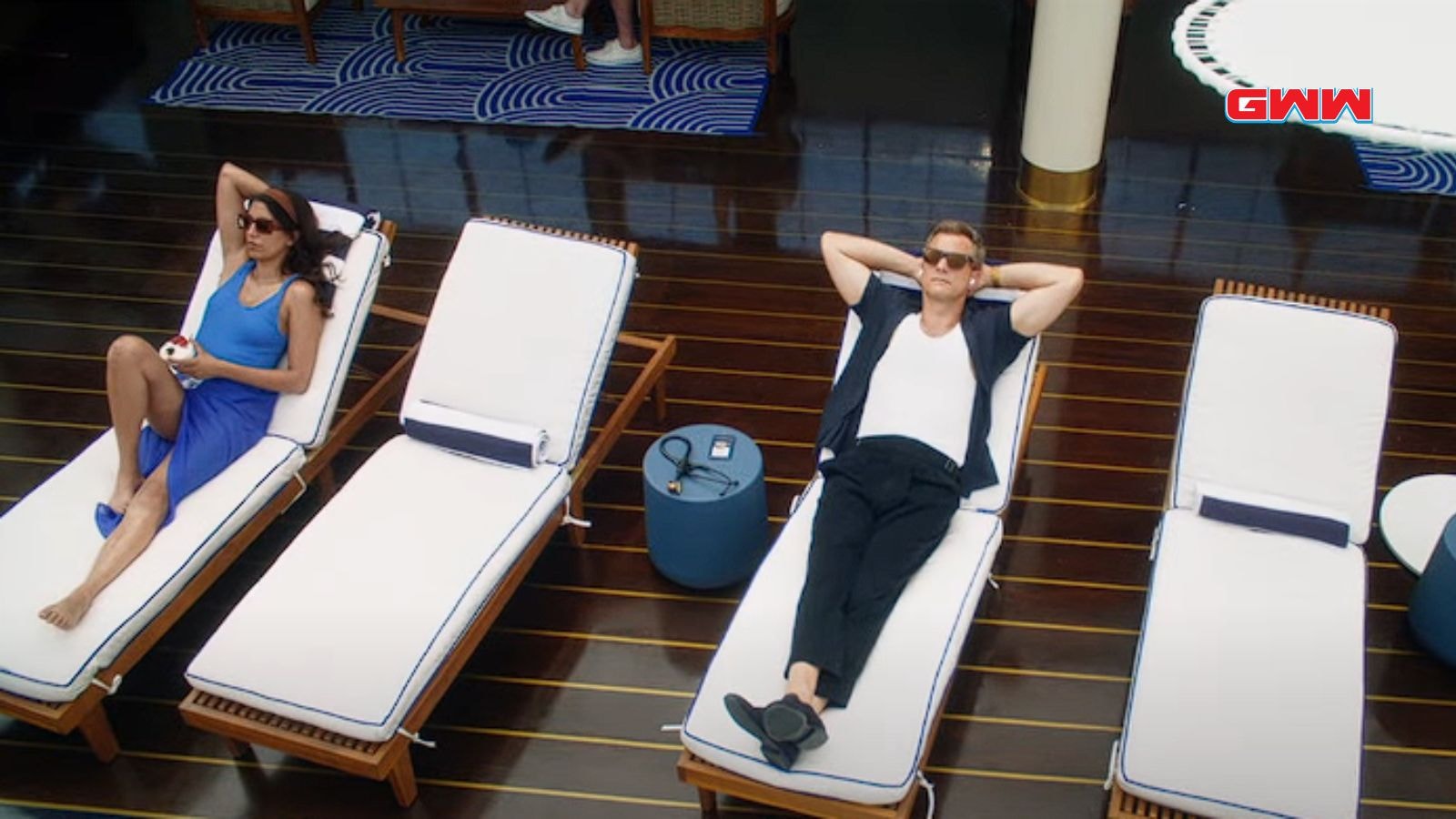 Joshua Jackson and Phillipa Soo lounging on a luxury cruise ship deck