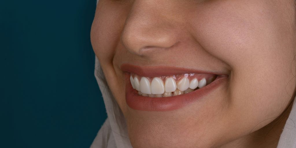 a close up of a woman with a smile on her face