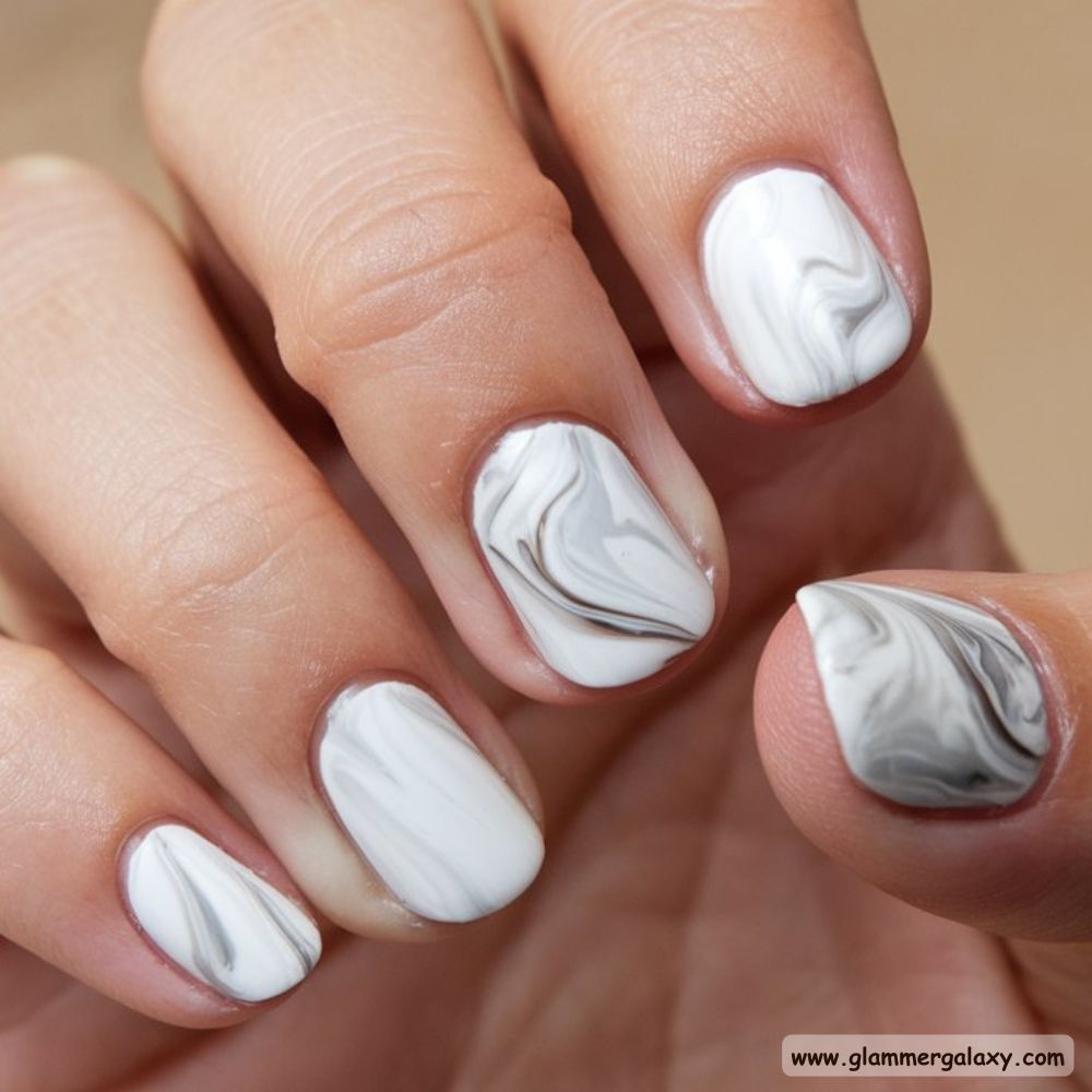 Neutral Nails having White Marble Effect
