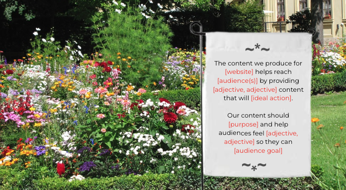 A flower bed with various flowers and colors surrounded by lush green grass.
