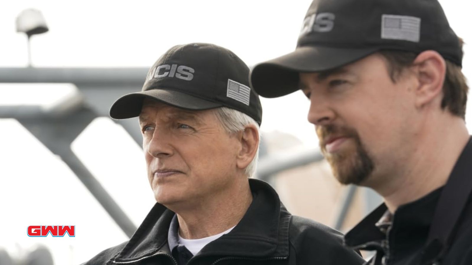 Leroy and Sean NCIS agents discussing an important case on a naval ship.