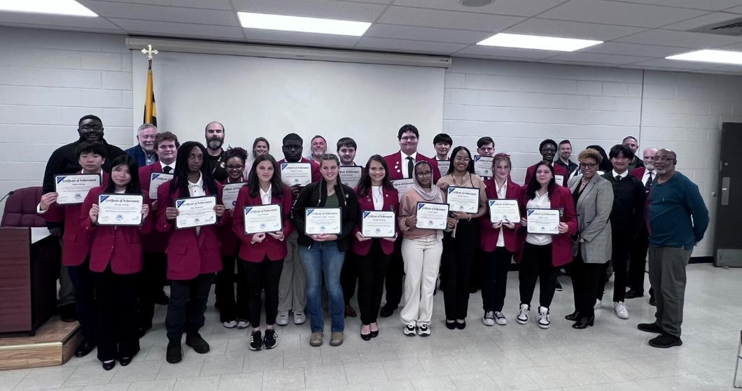 SkillsUSA award recipients with certificates in the board room