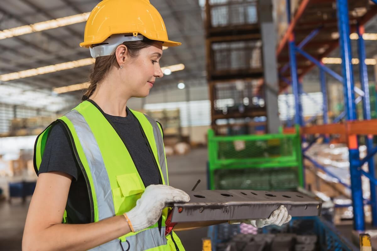 Engineer checking a piece of metal