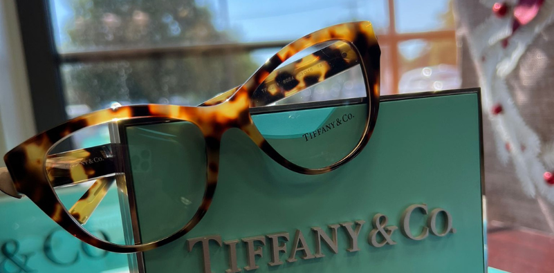 A pair of glasses on a boxDescription automatically generated