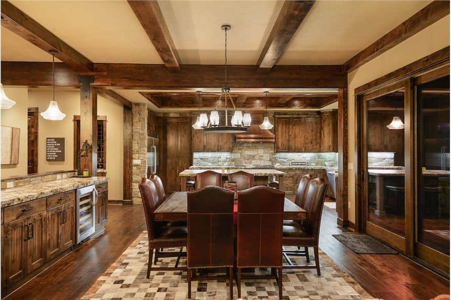 Dining area with 8-seater dining set under the beamed ceiling.