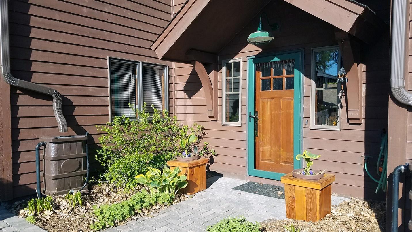 Rain Barrel Kit Installed In front of House