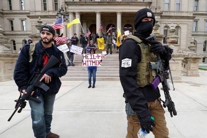 A group of people in masks holding guns

AI-generated content may be incorrect.