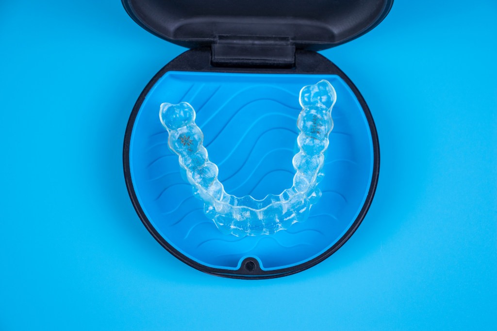 clear-invisalign-aligners-in-a-blue-protective-case-designed-for-teeth-straightening