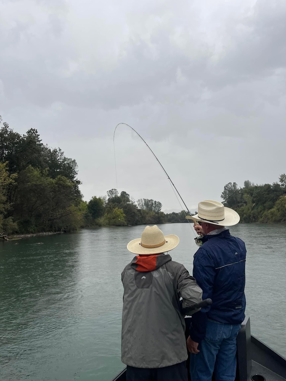 Two men fishing on a river

AI-generated content may be incorrect.