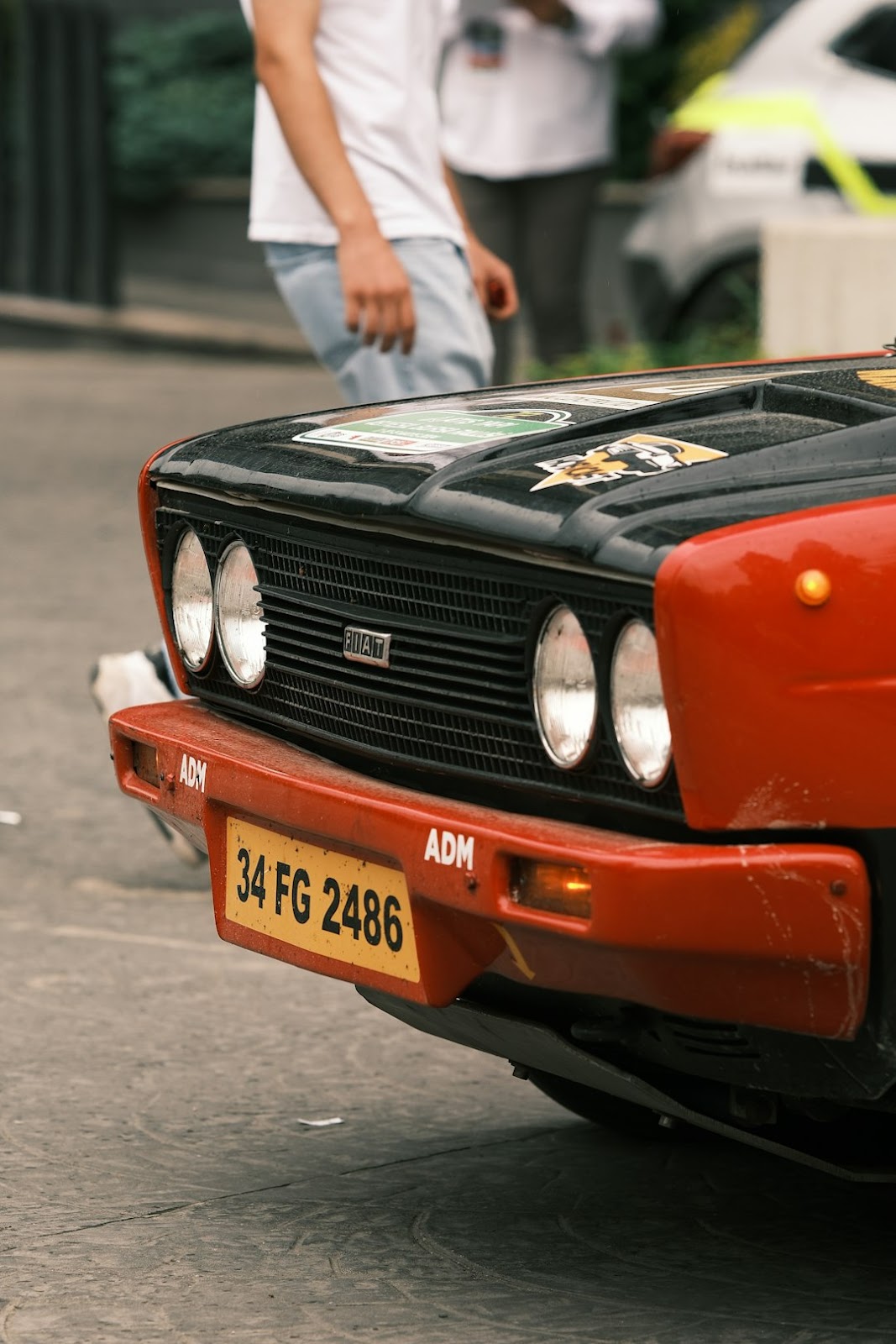 A red car parked on the side of the road