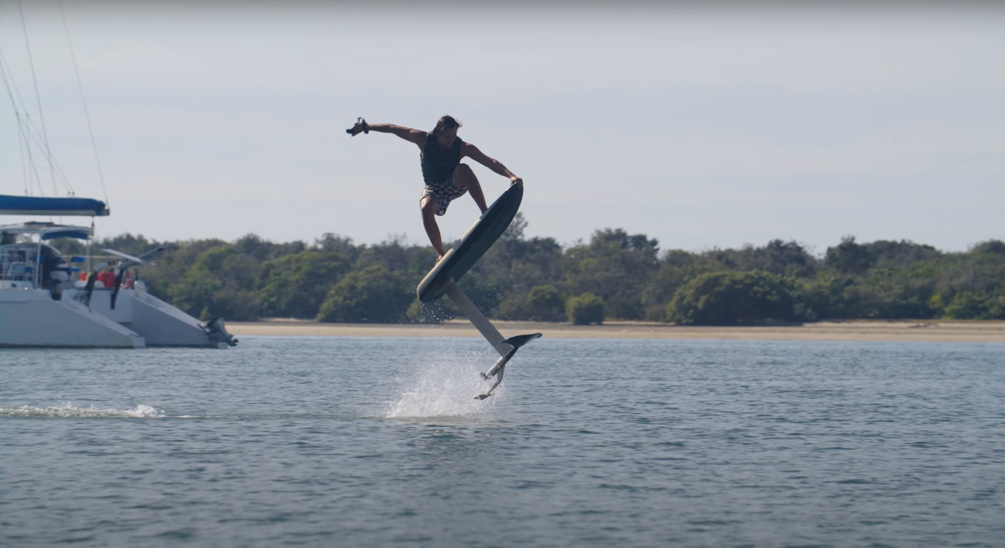 A person on a surfboard

Description automatically generated