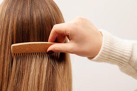 A female combing her hair