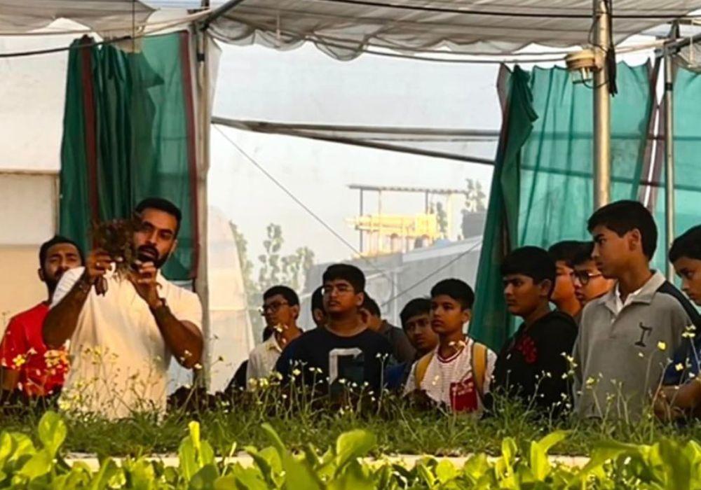 A man in hand explaining about hydroponic farming