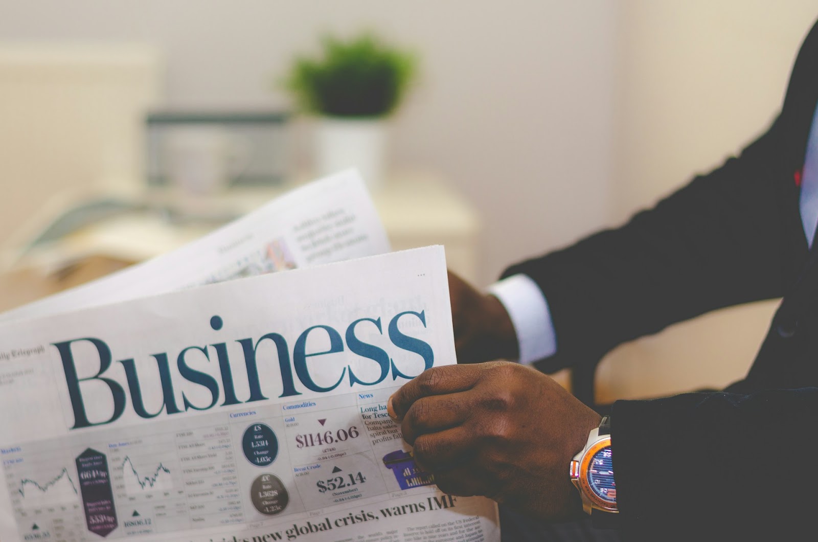 A man reading the business page of the newspaper