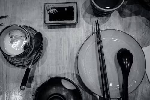 Table with common Japanese tableware, including chopsticks and plates